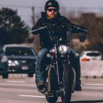 Man Riding Motorcycle on Highway